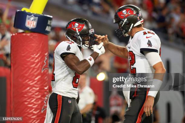 Antonio Brown and Tom Brady of the Tampa Bay Buccaneers celebrate their touchdown during the second quarter against the Dallas Cowboys at Raymond...