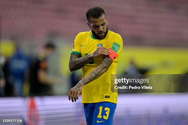 Dani Alves of Brazil fixes his captain's armband during a match between Brazil and Peru as part of South American Qualifiers for Qatar 2022 at Arena...