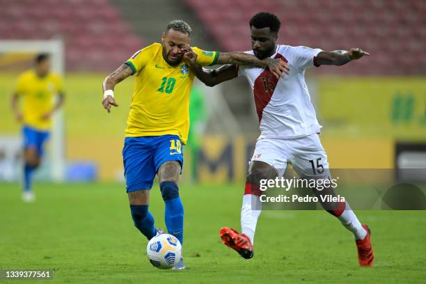 Neymar Jr. Of Brazil fights for the ball with Christian Ramos of Peru during a match between Brazil and Peru as part of South American Qualifiers for...