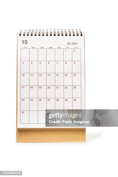 october month, calendar desk 2021 for organizer to planning and reminder isolated on white background. clipping path - united nations day stock pictures, royalty-free photos & images