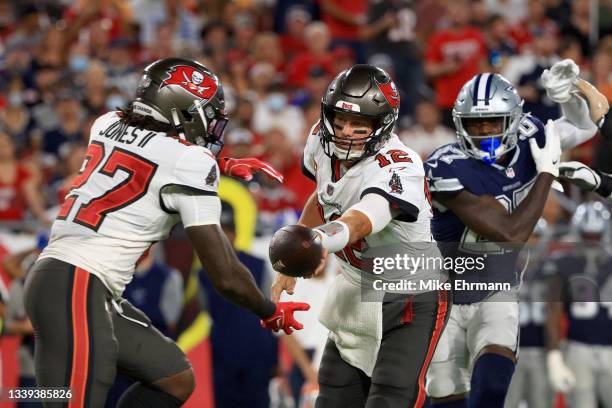 Tom Brady hands off the ball to Ronald Jones II of the Tampa Bay Buccaneers during the first quarter against the Dallas Cowboys at Raymond James...