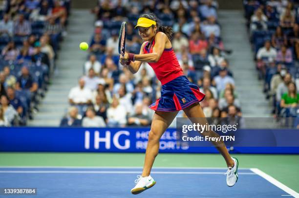 Emma Raducanu of Great Britain hits a backhand against Maria Sakkari of Greece in the semifinals of the women's singles of the US Open at the USTA...