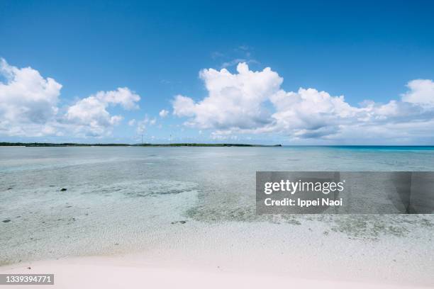 white sand tropical beach with coral-reef lagoon - okinawa blue sky beach landscape stock pictures, royalty-free photos & images