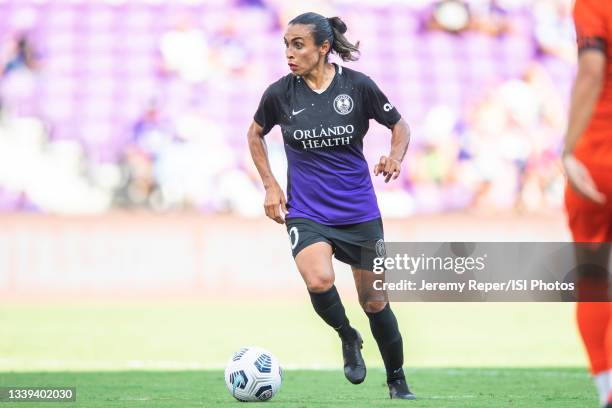 Marta of the Orlando Pride dribbles the ball during a game between Houston Dash and Orlando Pride at Exploria Stadium on September 5, 2021 in...