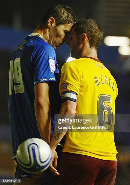 Nikola Zigic of Birmingham City battles squares up with Chris McCann of Burnley during the npower Championship match between Birmingham City and...