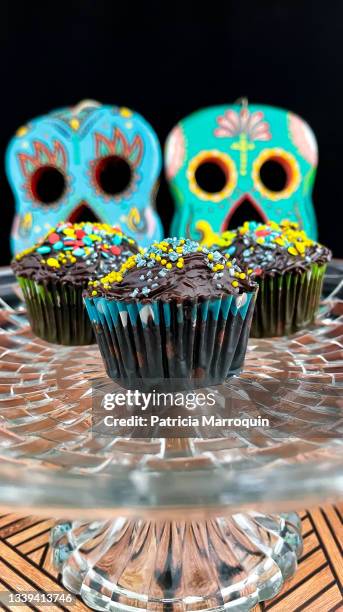 chocolate cupcakes and sugar skulls - sugar skull stock pictures, royalty-free photos & images