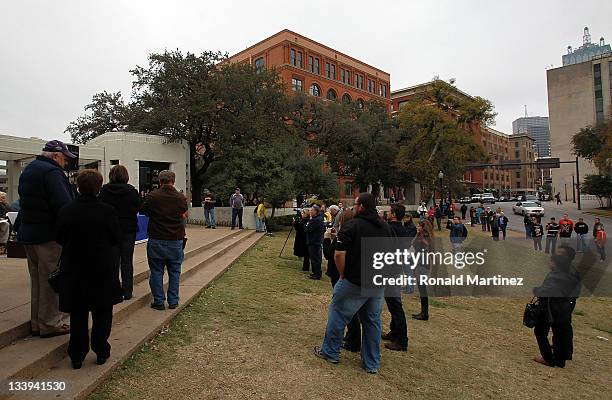 People gather on the 48th anniversary of JFK's assassination in Dealey Plaza on November 22, 2011 in Dallas, Texas. The 48th anniversary of the...