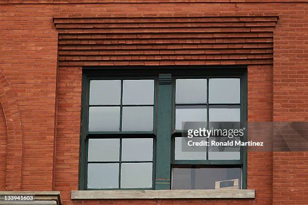 The sixth floor window of the former Texas School Book Depository, now the Dallas County Administration Building on the 48th anniversary of JFK's...