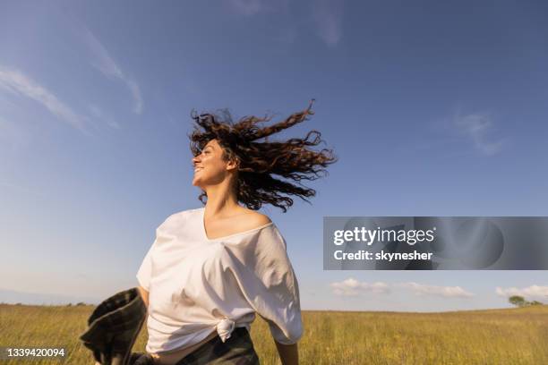 carefree woman having fun in spring day. - shaking hair stock pictures, royalty-free photos & images