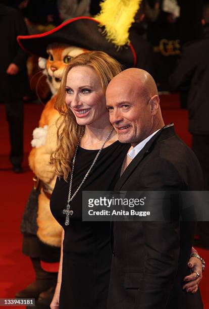 Actress Andrea Sawatzki and actor Christian Berkel attend the 'Puss In Boots' Premiere at CineStar on November 22, 2011 in Berlin, Germany.