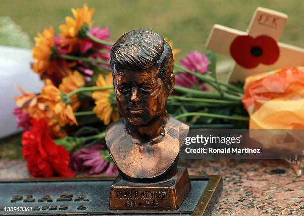 Small statue of John F. Kennedy on the 48th anniversary of JFK's assassination in Dealey Plaza on November 22, 2011 in Dallas, Texas. The 48th...