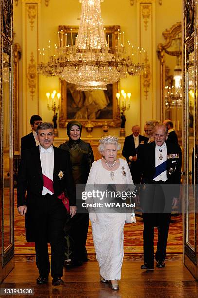 Queen Elizabeth II and her husband Prince Philip, Duke Of Edinburgh prepare to pose for a formal picture with President of Turkey Abdullah Gul and...