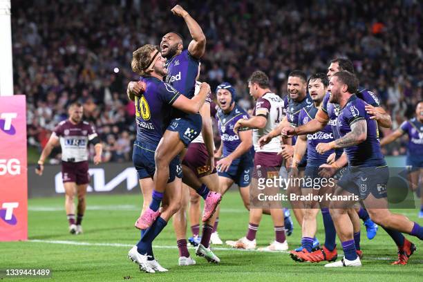 Christian Welch of the Storm celebrates with Justin Olam of the Storm after scoring a try during the NRL Qualifying Final between the Melbourne Storm...