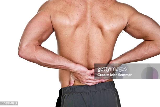 man with lower back pain - lower back pain stock pictures, royalty-free photos & images