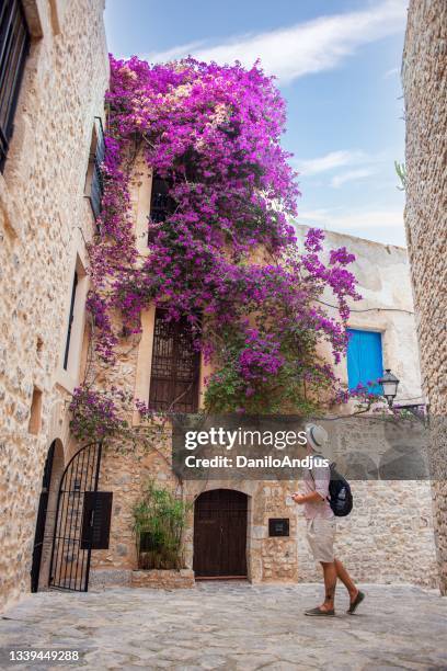 portrait of a young man standing on ibiza street - ibiza town stock pictures, royalty-free photos & images