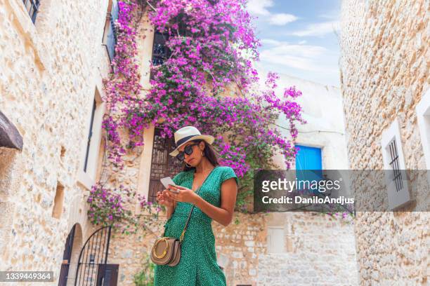the young woman is enjoying her vacation - ibiza island stock pictures, royalty-free photos & images