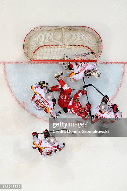 Felix Schuetz of Cologne fails to score during the DEL match between Koelner Haie and DEG Metro Stars at Lanxess Arena on November 22, 2011 in...