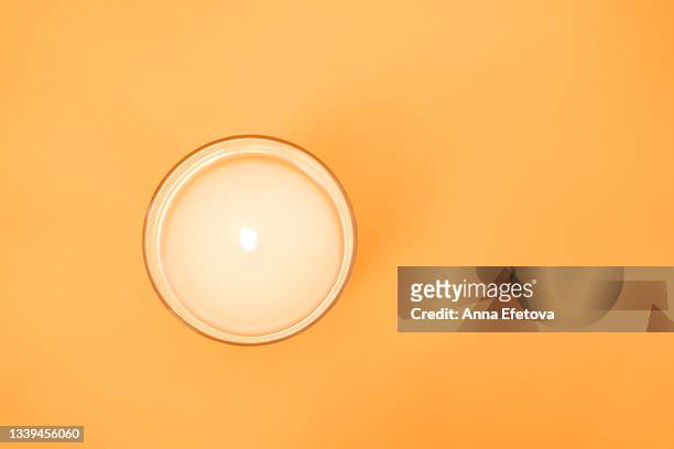 burning candle on yellow background. set for aromatherapy and rituals. copy space for your design. flat lay style - candle white background imagens e fotografias de stock