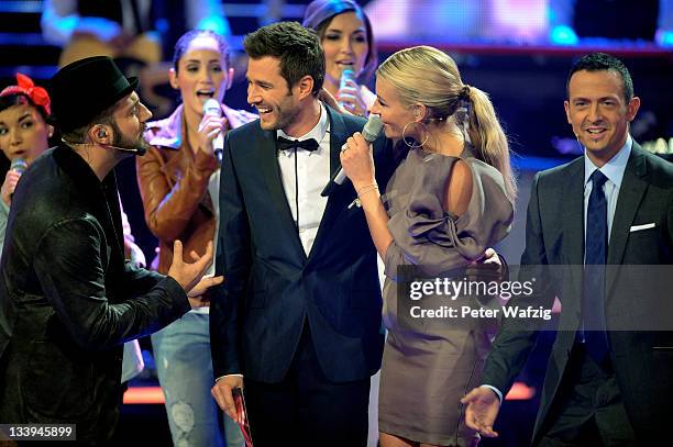The jury members and artists perform a birthday song for host Jochen Schropp during 'The X Factor Live' TV-Show on November 22, 2011 in Cologne,...