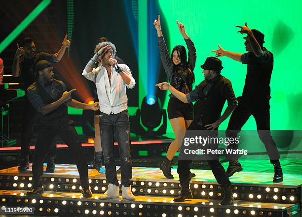 Rufus Martin performs his second song on stage during 'The X Factor Live' TV-Show on November 22, 2011 in Cologne, Germany.