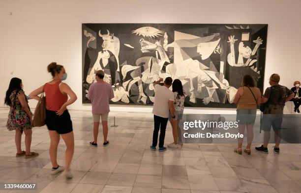 People view Pablo Picasso's Guernica painting at the Reina Sofia Museum during celebrations to mark the 40th anniversary of the arrival of the...