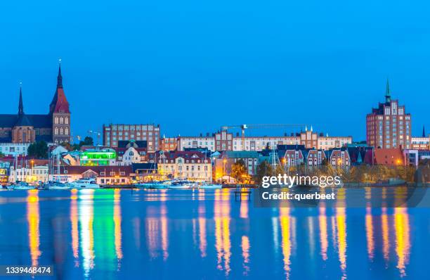 skyline rostock at sunset - rostock stock pictures, royalty-free photos & images