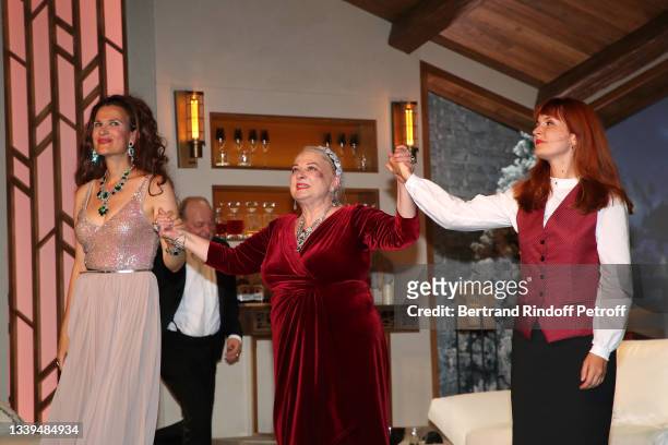 Armelle Lesniak, autor of the piece Josiane Balasko and Justine Le Pottier acknowledge the applause of the audience at the end of the "Un chalet à...