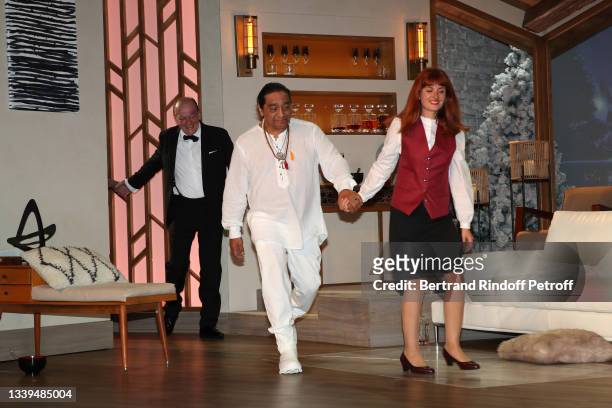 Stéphan Wojtowicz, George Aguilar and Justine Le Pottier acknowledge the applause of the audience at the end of the "Un chalet à Gstaad" Theater Play...