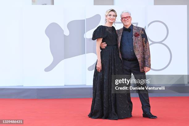 Alessandra Mion and Ernst Knam attend the red carpet of the movie "Ennio " during the 78th Venice International Film Festival on September 10, 2021...