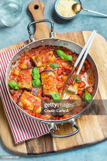 baked eggplants roll in tomato sauce - aubergine stock pictures, royalty-free photos & images