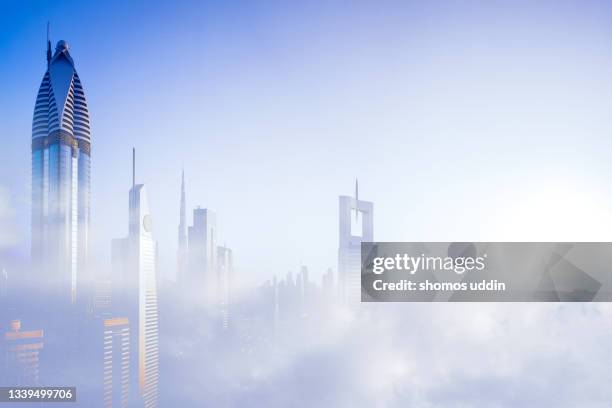 aerial cityscape of dubai skyline through clouds - digital composite - pays du golfe photos et images de collection