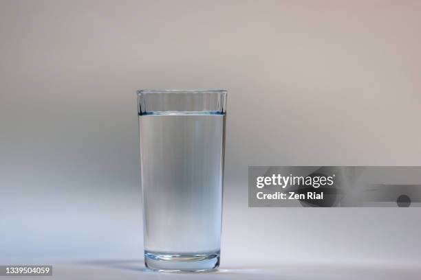 one glass of drinking water - volume fluid capacity stock pictures, royalty-free photos & images