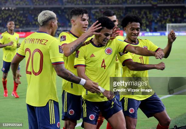 Players of Colombia celebrate after Luis Diaz scored the third goal of their team during a match between Colombia and Chile as part of South American...