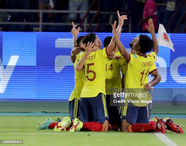 Players of Colombia celebrate after Mieguel Borja scored the first goal of their team during a match between Colombia and Chile as part of South...
