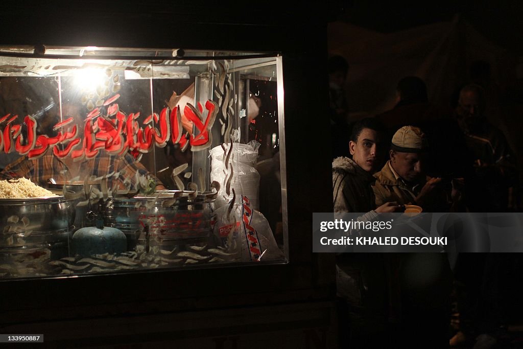 An Egyptian protester eats the tradition