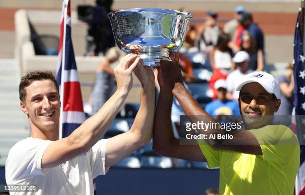Joe Salisbury of Great Britain and Rajeev Ram of the United States celebrate with the trophy after defeating Jamie Murray of Great Britain and Bruno...