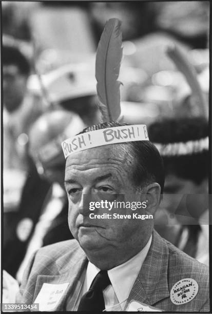 Portrait of an unidentified delegate as he sits on the floor of the Republican National Convention at Joe Louis Arena, Detroit, Michigan, between...