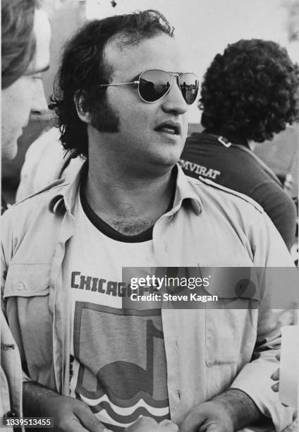 View of comedian and musician John Belushi backstage before a performance by his group, the Blues Brothers, at an unspecified venue, Chicago,...