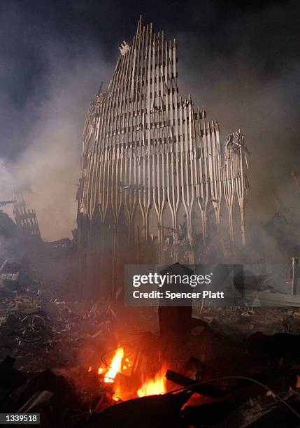 Rubble burns at the remains of the destroyed World Trade Center towers September 12, 2001 in New York City.