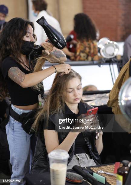 Gigi Hadid prepares backstage at the SP22 Michael Kors Collection Runway Show at Tavern On The Green on September 10, 2021 in New York City.