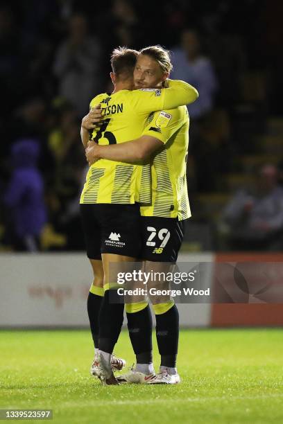 Luke Armstrong of Harrogate Town celebrates with teammate Alex Pattison after scoring their side's second goal during the Sky Bet League Two match...