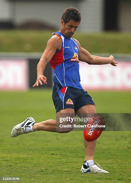 Lindsay Gilbee of the Bulldogs kicks the ball during a Western Bulldogs AFL training session at Whitten Oval on November 23, 2011 in Melbourne,...