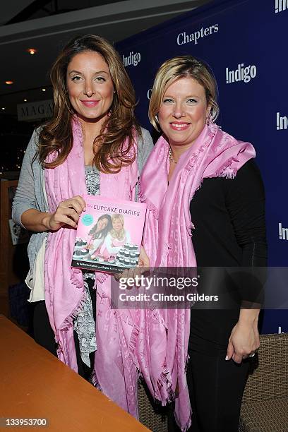 Katherine Kallinis and Sophie Kallinis LaMontagne sign copies of "The Cupcake Diaries" at Indigo Yorkdale on November 22, 2011 in Toronto, Canada.