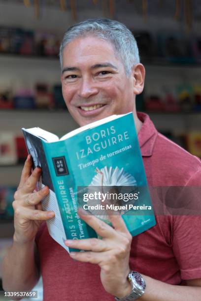 Venezuelan writer Boris Izaguirre poses during the signing of his latest book, "Tiempos de tormentas", at the Madrid Book Fair on September 10, 2021...