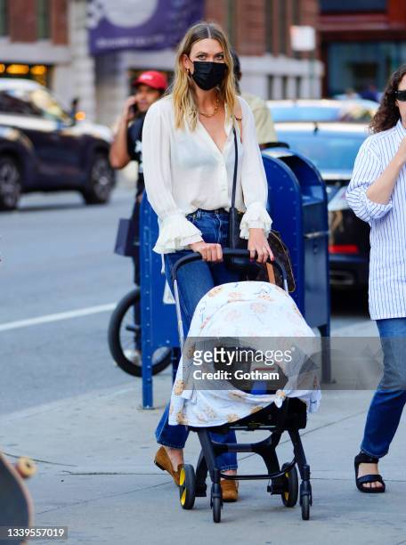 Karlie Kloss is seen with her baby during fashion week on September 10, 2021 in New York City.