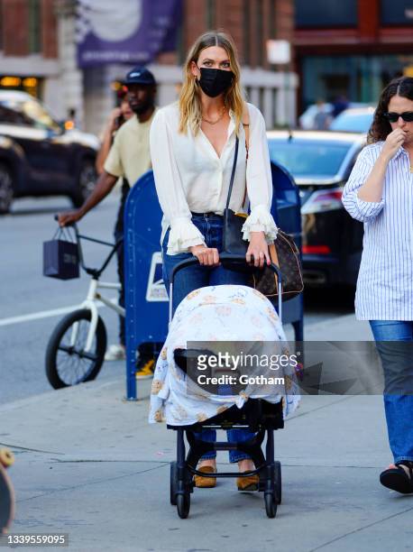Karlie Kloss is seen with her baby during fashion week on September 10, 2021 in New York City.