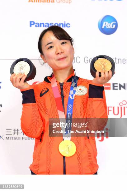 Table tennis mixed doubles gold medalist, Women's Team silver medalist and Women's Singles bronze medalist Mima Ito poses the Japanese medalists...