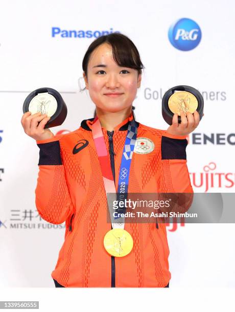 Table tennis mixed doubles gold medalist, Women's Team silver medalist and Women's Singles bronze medalist Mima Ito poses the Japanese medalists...