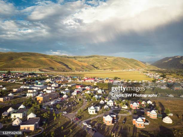 drone photo of yurts in the grasslands in xinjiang province, china - grass land stock pictures, royalty-free photos & images