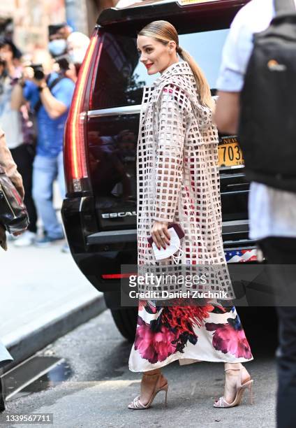 Olivia Palermo is seen wearing a cream Jason Wu cut out coat outside the Jason Wu show during New York Fashion Week S/S 22 on September 10, 2021 in...